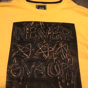 Like new/ never give up yellow tshirt